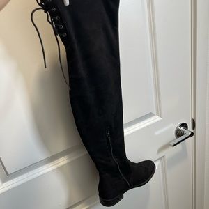 Black knee-high boots with no heel